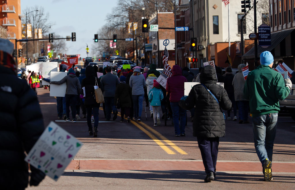 People march down Broadway and Tenth Street
